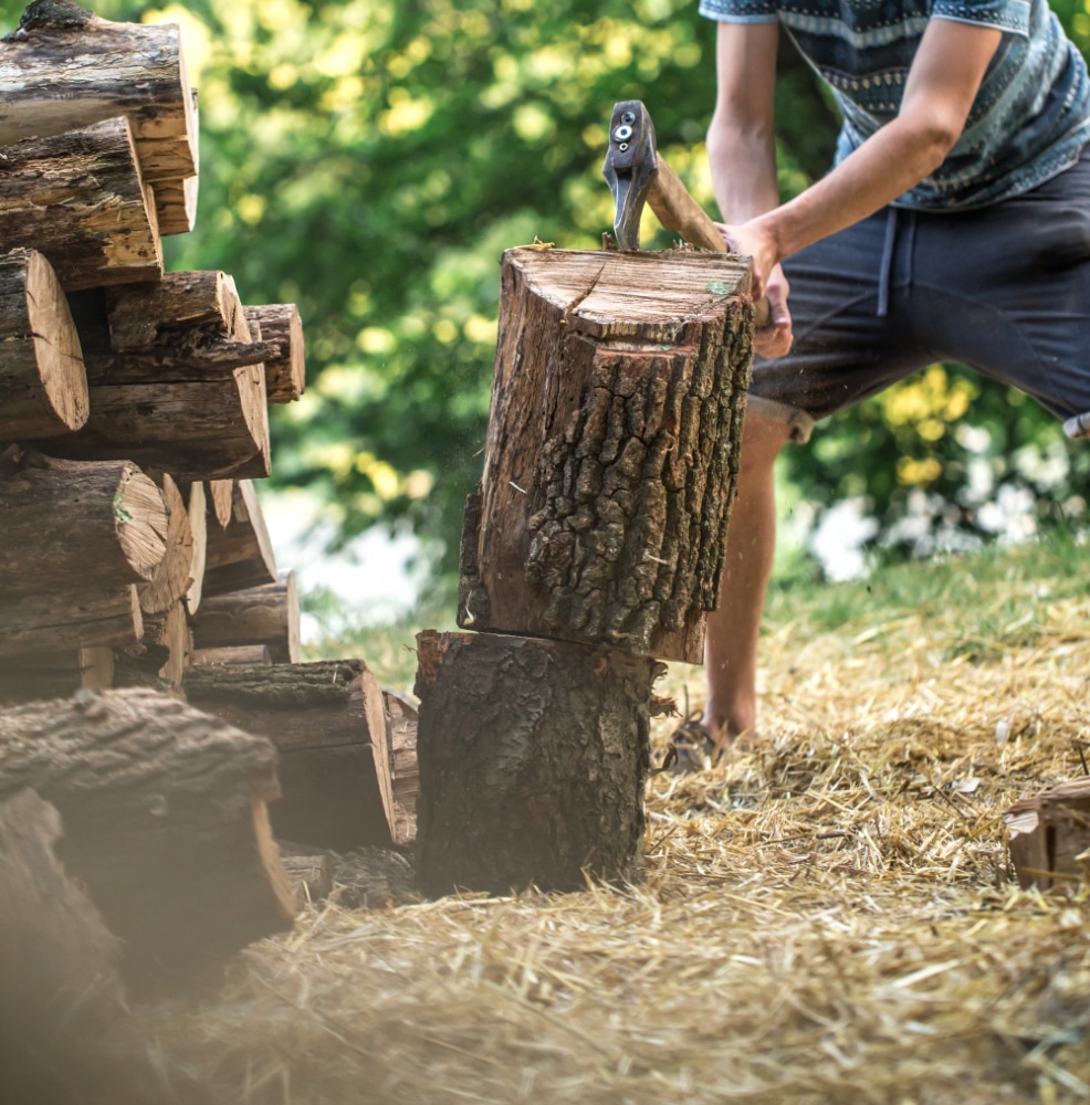 man chopping wood with